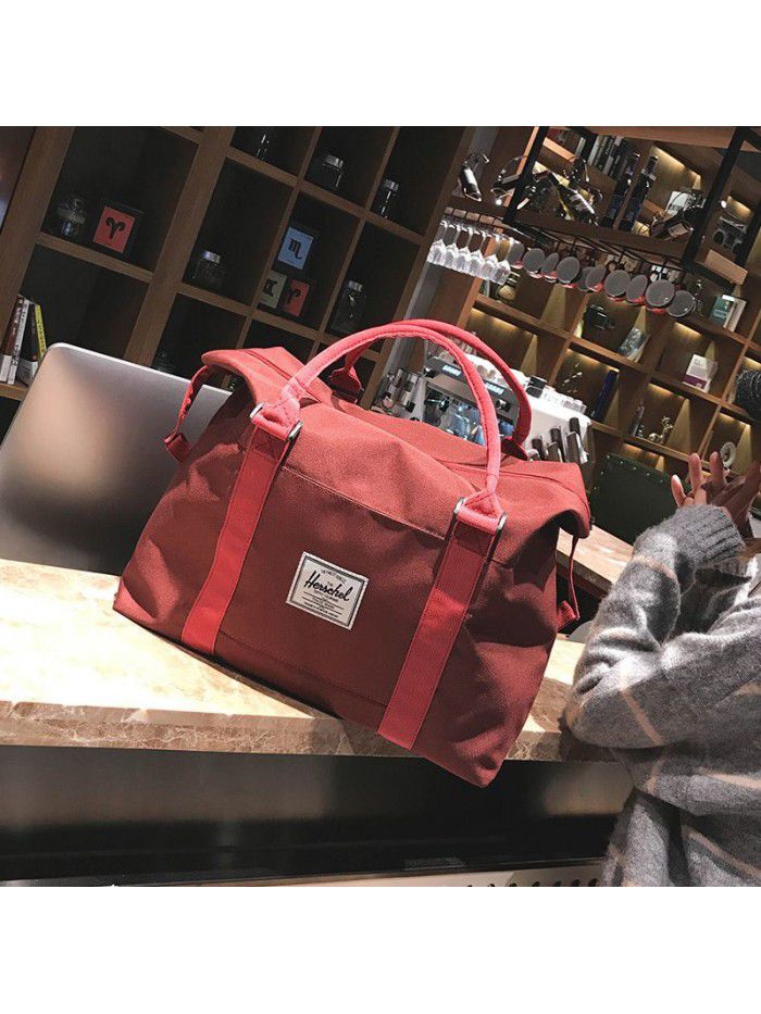 Manufacturers wholesale boarding bags, solid color, large capacity, wear-resistant and load reducing, customized hand-held travel bags, luggage bags and travel bags