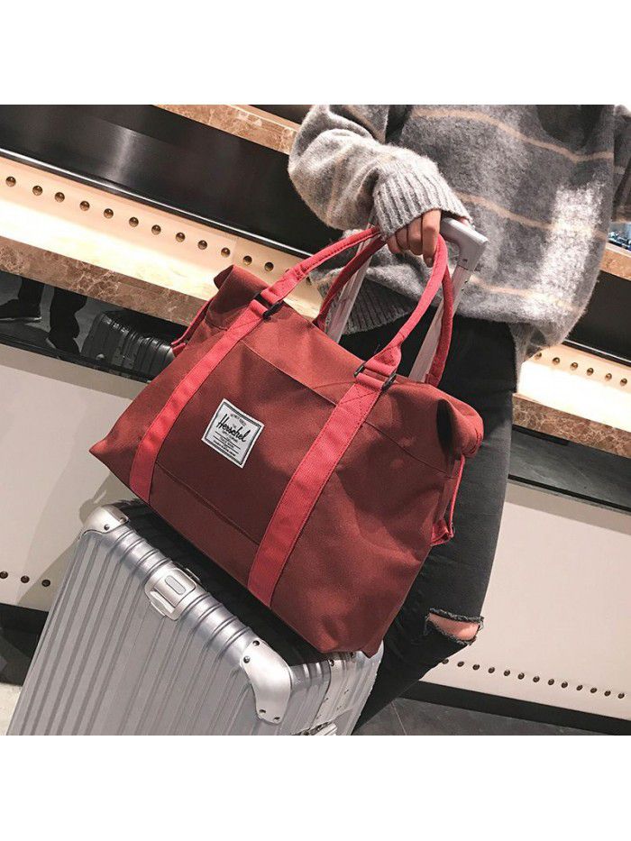 Manufacturers wholesale boarding bags, solid color, large capacity, wear-resistant and load reducing, customized hand-held travel bags, luggage bags and travel bags